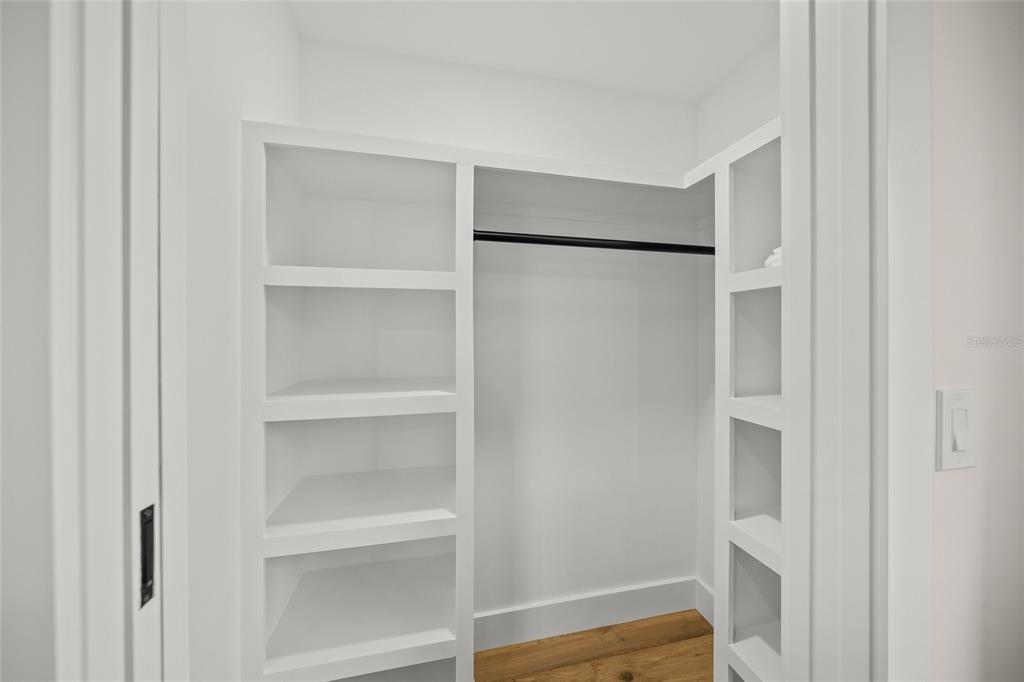 525 68th Street Holmes Beach, FL 34217 - Photo 33 of 52 a view of walk in closet with empty racks