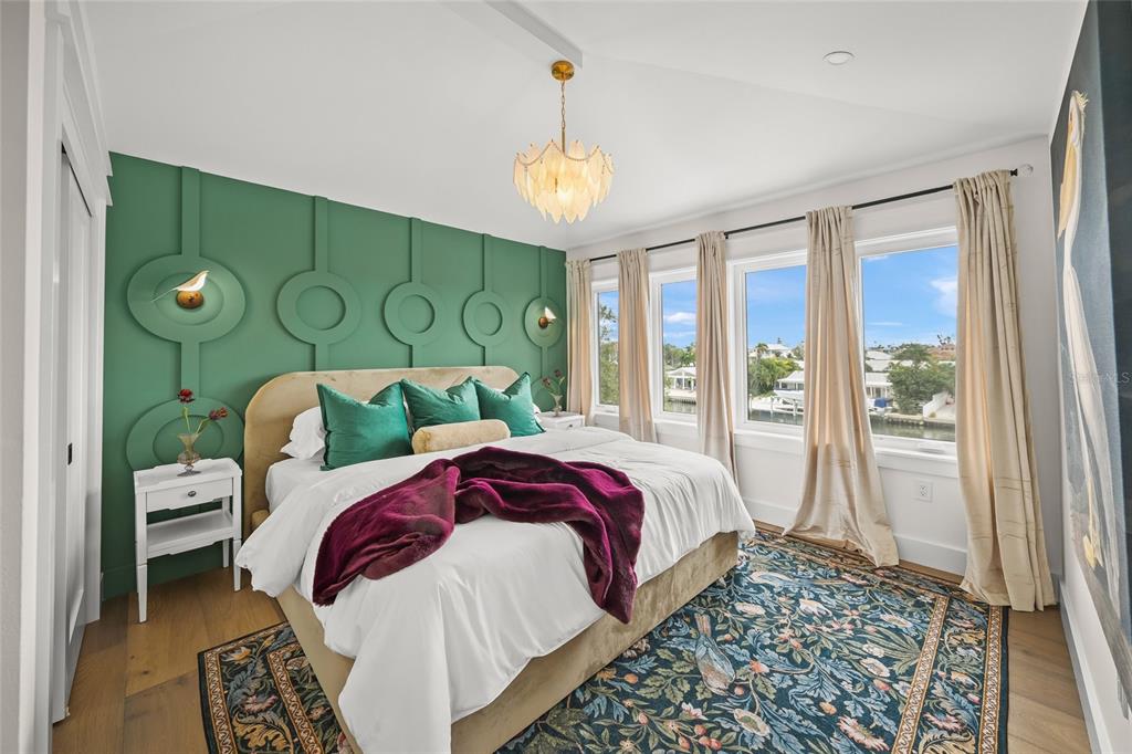 525 68th Street Holmes Beach, FL 34217 - Photo 34 of 52 a bed sitting in a bedroom next to a window