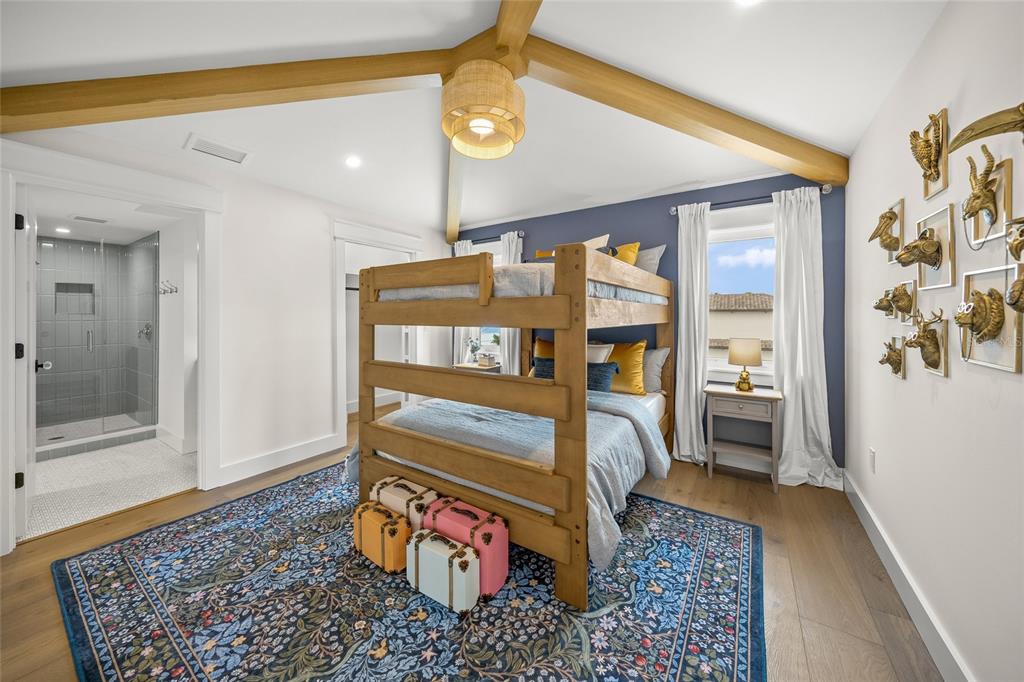 525 68th Street Holmes Beach, FL 34217 - Photo 36 of 52 a bedroom with a bed and a window