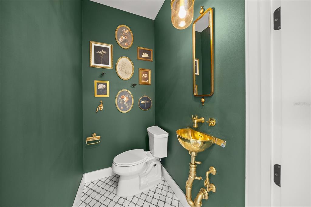 525 68th Street Holmes Beach, FL 34217 - Photo 40 of 52 a bathroom with a toilet sink and mirror