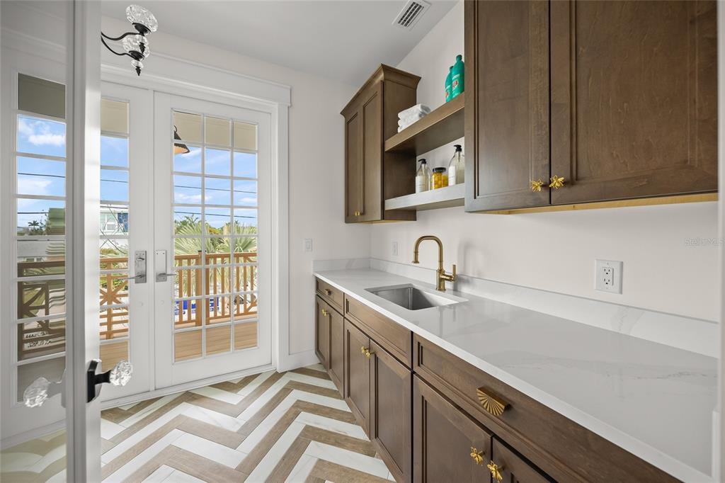 525 68th Street Holmes Beach, FL 34217 - Photo 43 of 52 a kitchen with a sink and a window