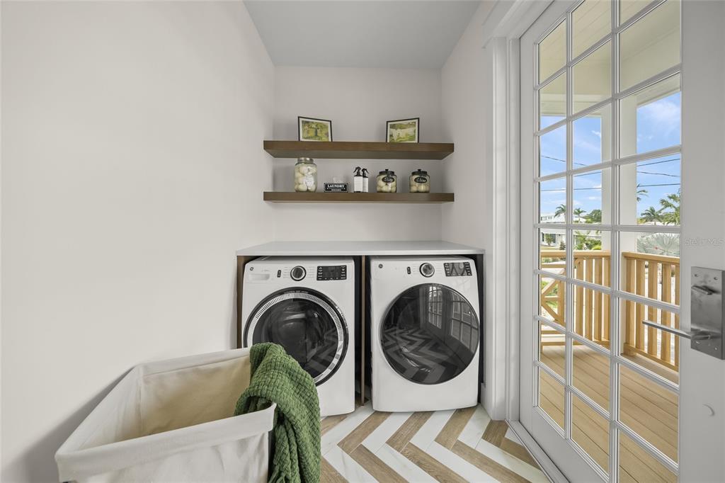 525 68th Street Holmes Beach, FL 34217 - Photo 44 of 52 a utility room with a sink dryer and washer