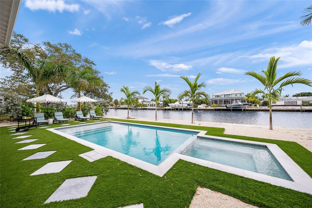 525 68th Street Holmes Beach, FL 34217 - Photo 47 of 52 a view of swimming pool with outdoor seating and yard