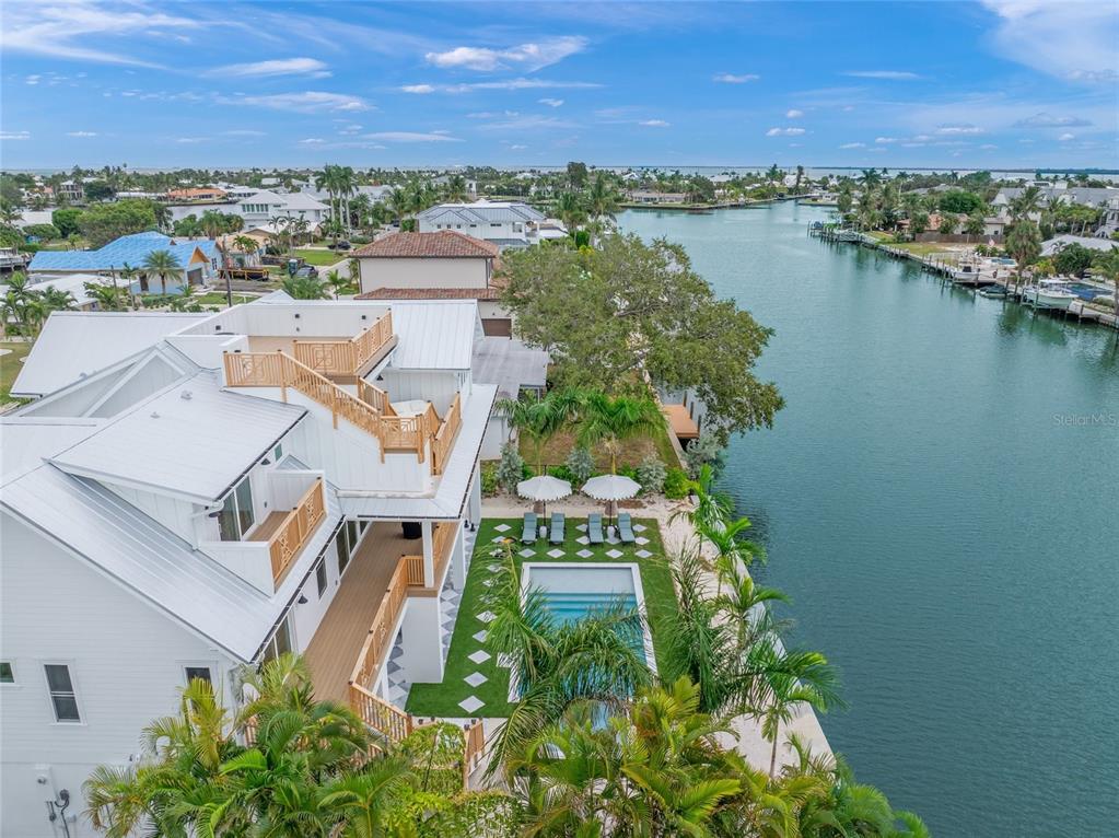 525 68th Street Holmes Beach, FL 34217 - Photo 49 of 52 an aerial view of residential house with outdoor space and lake view
