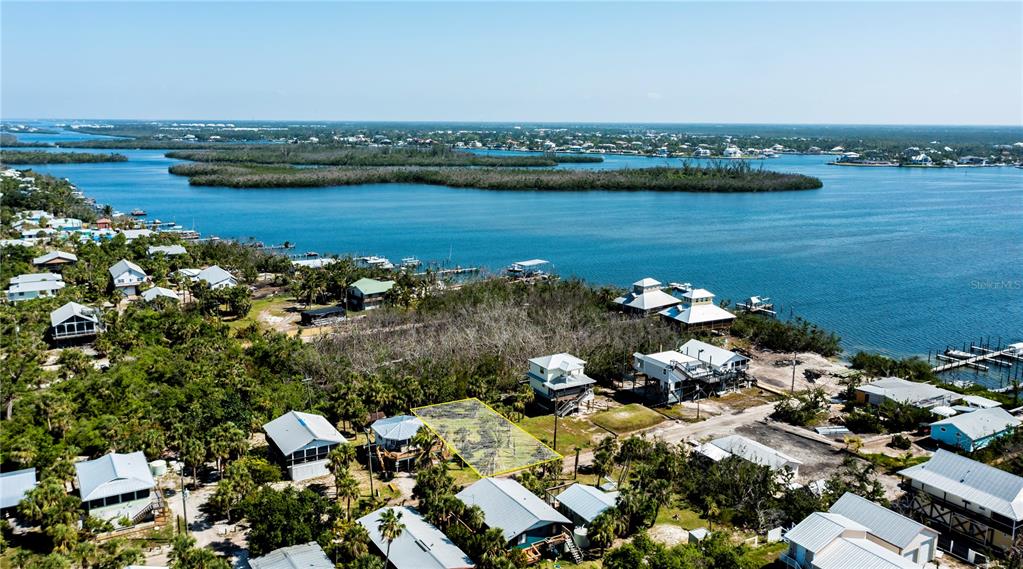 8864 Bay Street Boca Grande, FL 33921 - Photo 15 of 25 an aerial view of ocean and residential houses with outdoor space