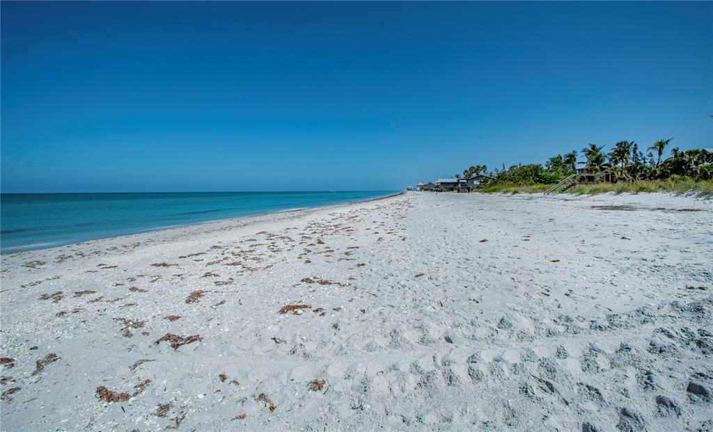 8864 Bay Street Boca Grande, FL 33921 - Photo 18 of 25 a view of a beach with a yard