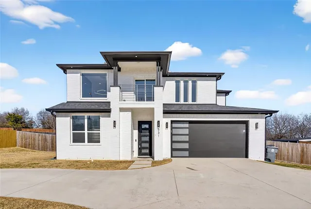 a front view of a house with yard