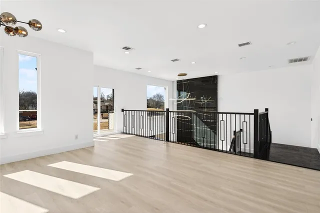 a view of a living room with wooden floor