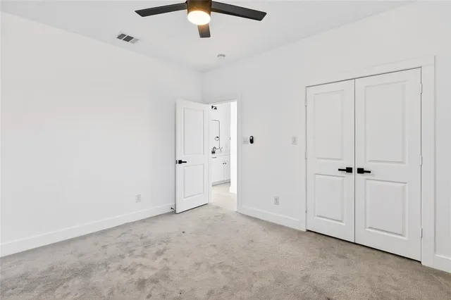 an empty room with fan