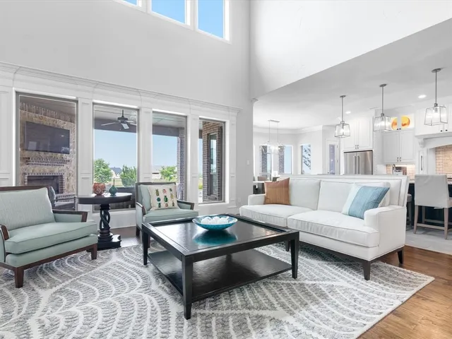 a living room with furniture flat screen tv and a fireplace