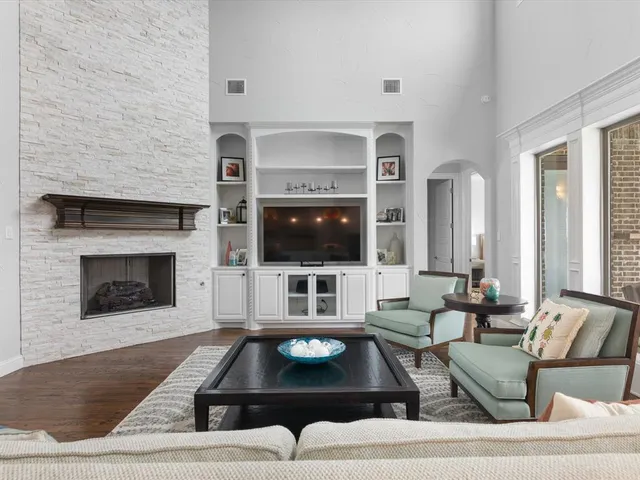 a view of a kitchen with stainless steel appliances granite countertop a sink and cabinets