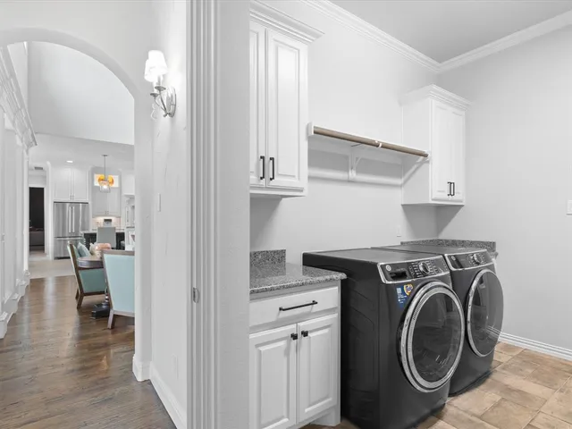 a bedroom with a large bed and a dresser