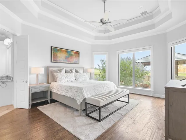 a bedroom with a bed and a night stand