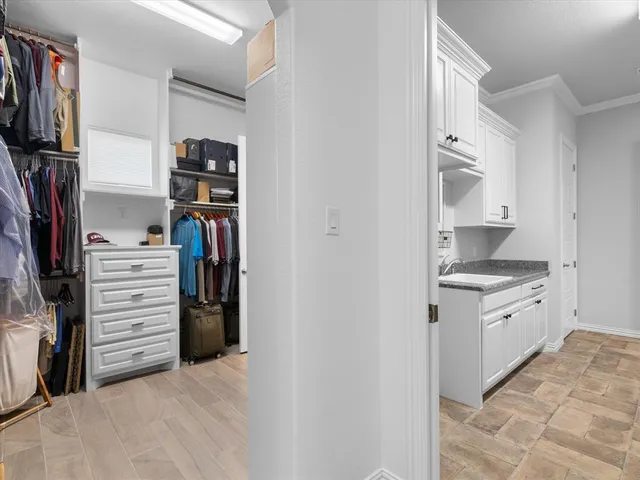 a view of staircase with wooden floor and a rug