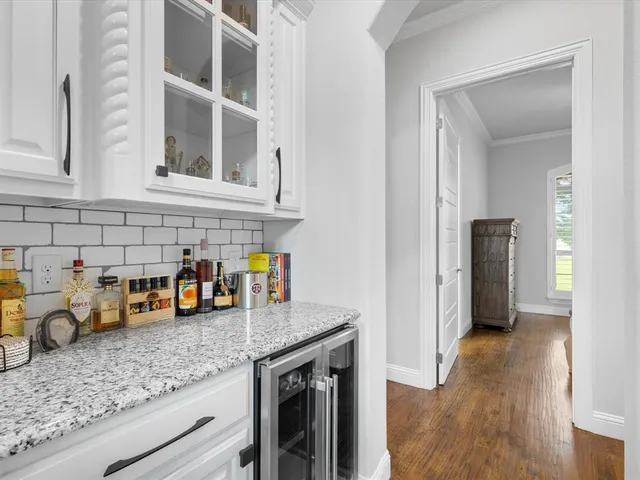 a kitchen with stainless steel appliances a stove and a microwave