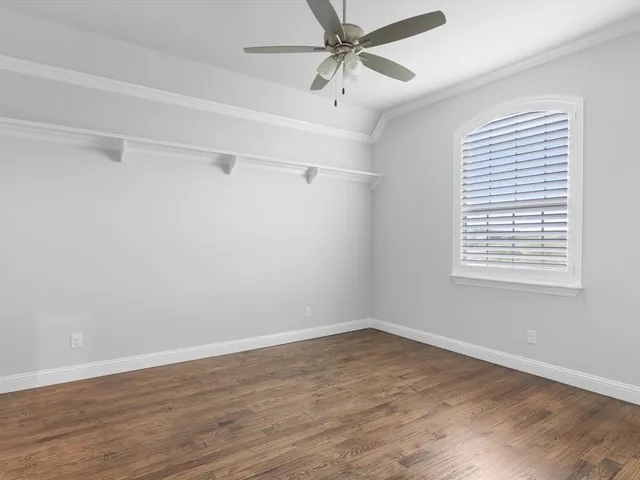 a en suite bathroom with a granite countertop sink and a mirror