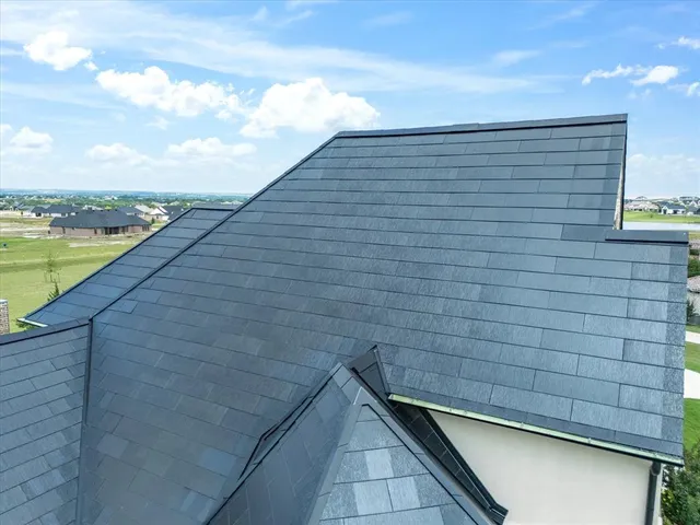a view of a dining room with furniture large windows and wooden floor