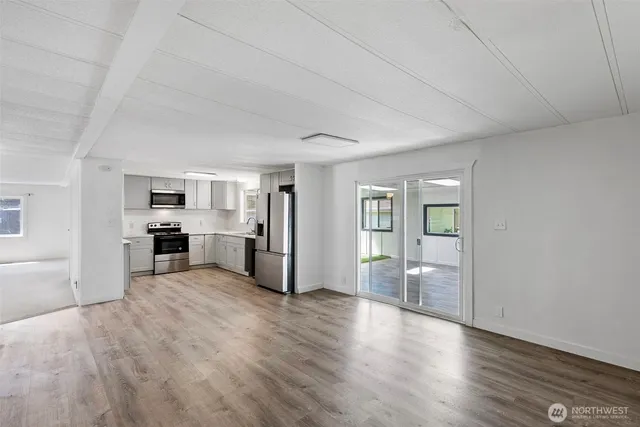 a view of a livingroom with furniture and wooden floor