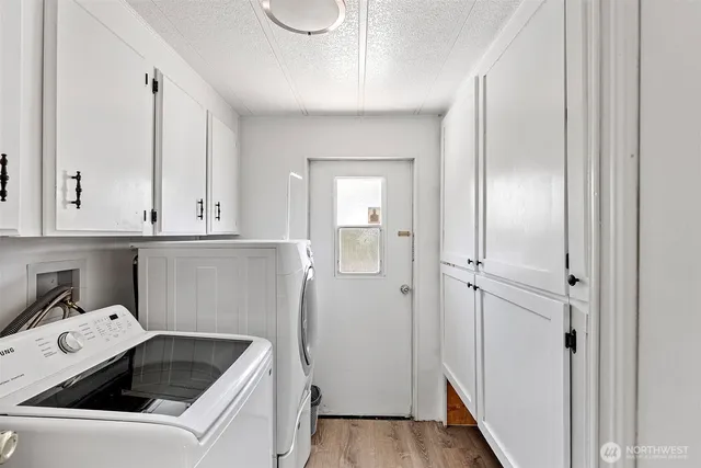 a view of room with window and wooden floor