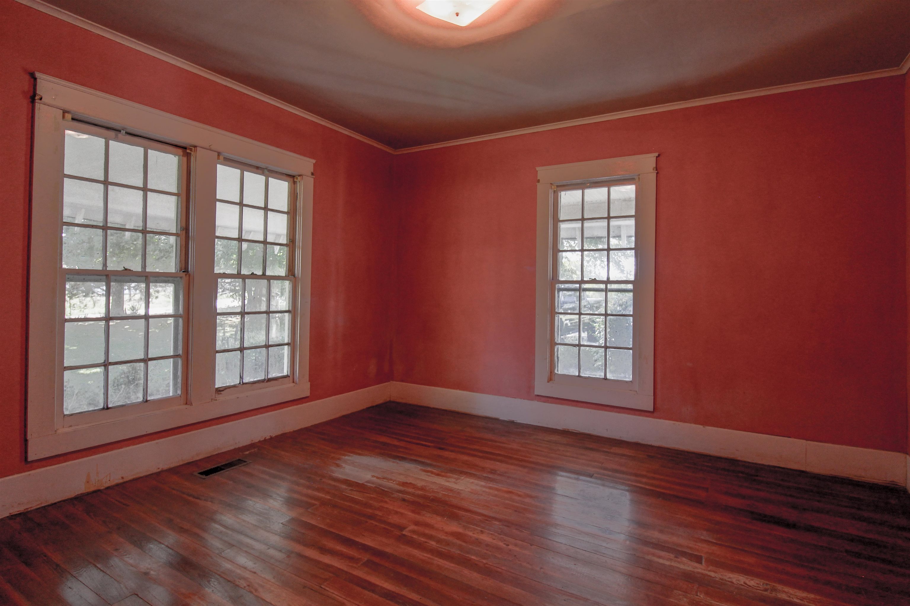 2440 Edith-Nankipoo Road Ripley, TN 38063 - Photo 14 of 27 a view of an empty room with wooden floor and a window