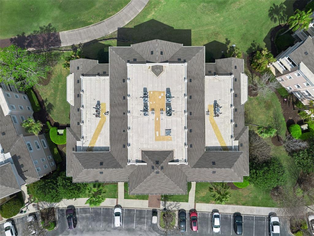 1352 Centre Ct Ridge Drive, Unit 302 Reunion, FL 34747 - Photo 25 of 42 an aerial view of multiple houses with outdoor space