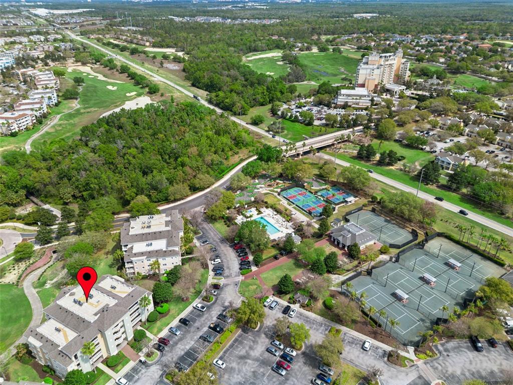 1352 Centre Ct Ridge Drive, Unit 302 Reunion, FL 34747 - Photo 28 of 42 an aerial view of residential houses with outdoor space