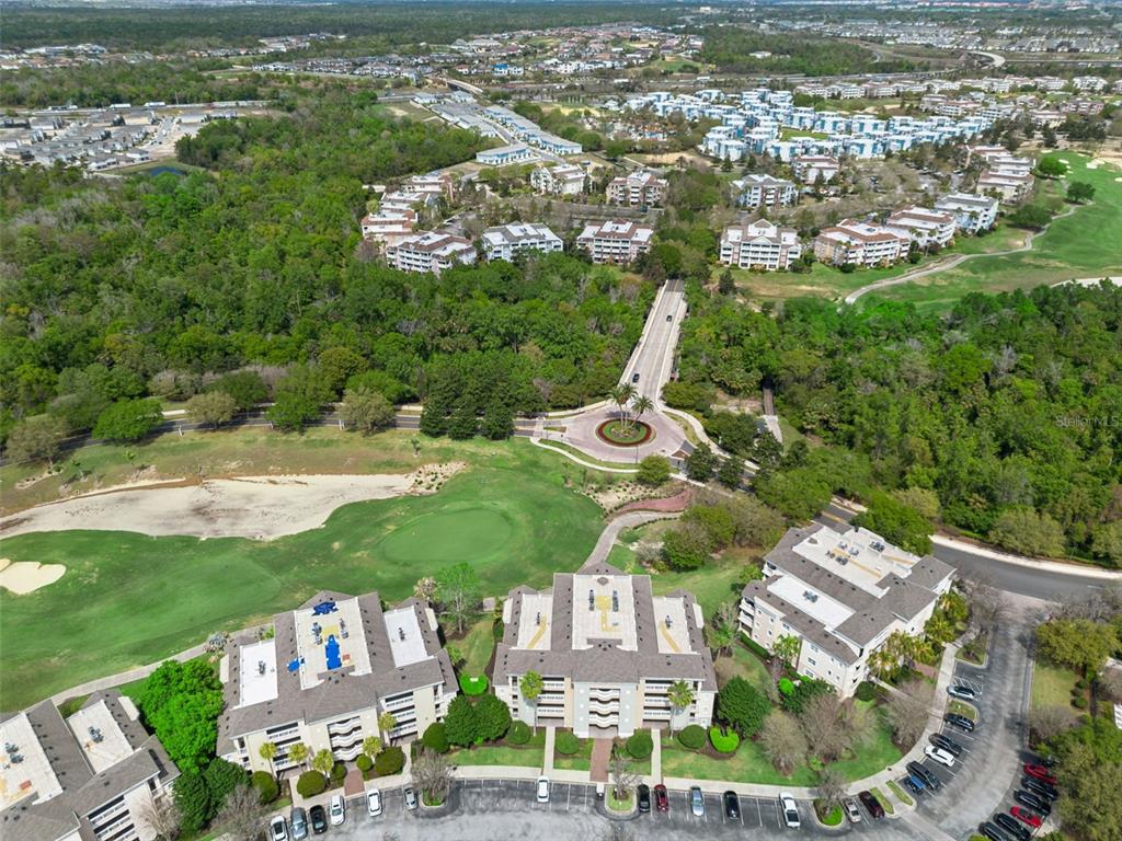 1352 Centre Ct Ridge Drive, Unit 302 Reunion, FL 34747 - Photo 30 of 42 an aerial view of residential houses with outdoor space and trees