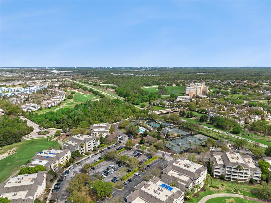 1352 Centre Ct Ridge Drive, Unit 302 Reunion, FL 34747 - Photo 35 of 42 an aerial view of residential houses with outdoor space and trees