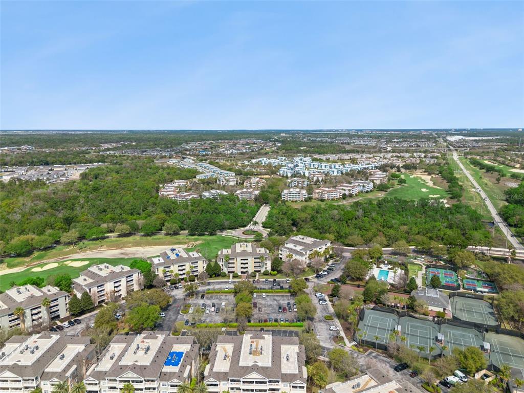 1352 Centre Ct Ridge Drive, Unit 302 Reunion, FL 34747 - Photo 37 of 42 an aerial view of a city with lots of residential buildings