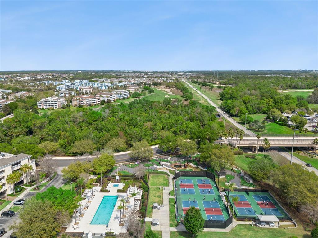 1352 Centre Ct Ridge Drive, Unit 302 Reunion, FL 34747 - Photo 40 of 42 an aerial view of residential houses with outdoor space and trees
