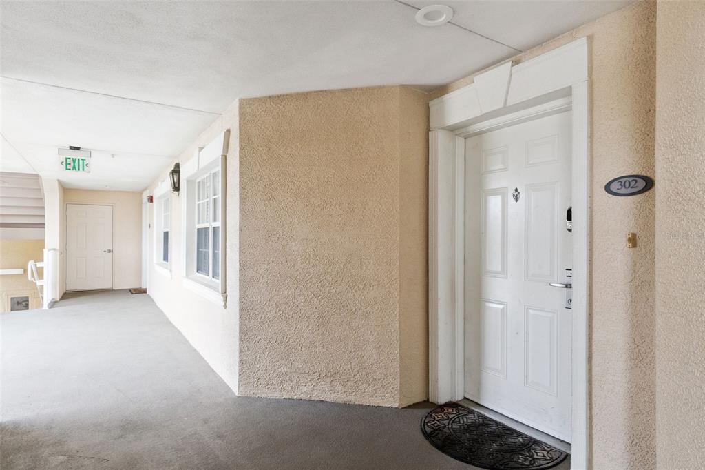 1352 Centre Ct Ridge Drive, Unit 302 Reunion, FL 34747 - Photo 6 of 42 a view of a hallway with a bedroom