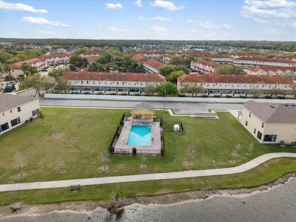 a view of a swimming pool and an outdoor seating