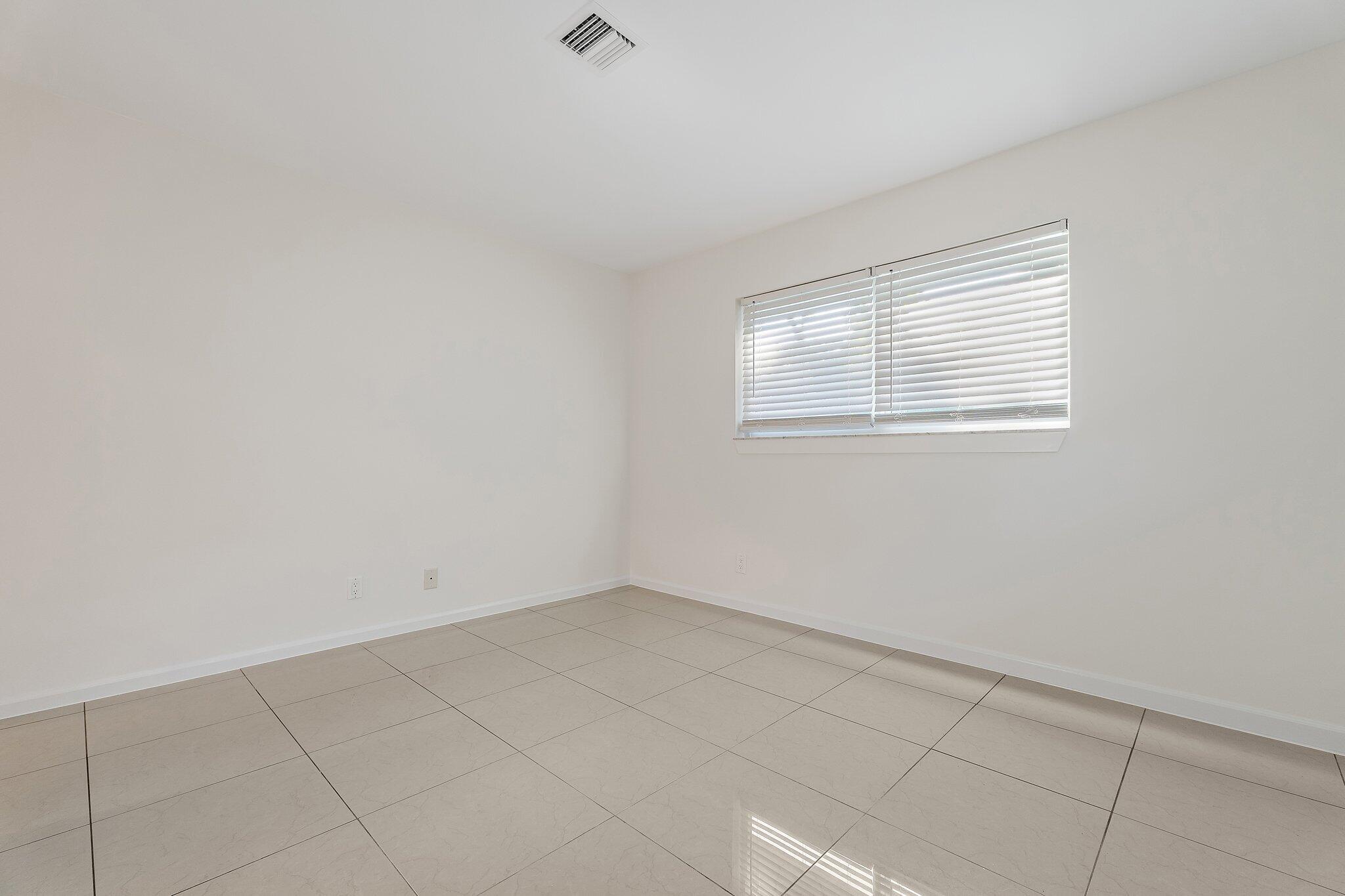 18799 Rio Vista Drive Jupiter, FL 33469 - Photo 37 of 58 an empty room with a window