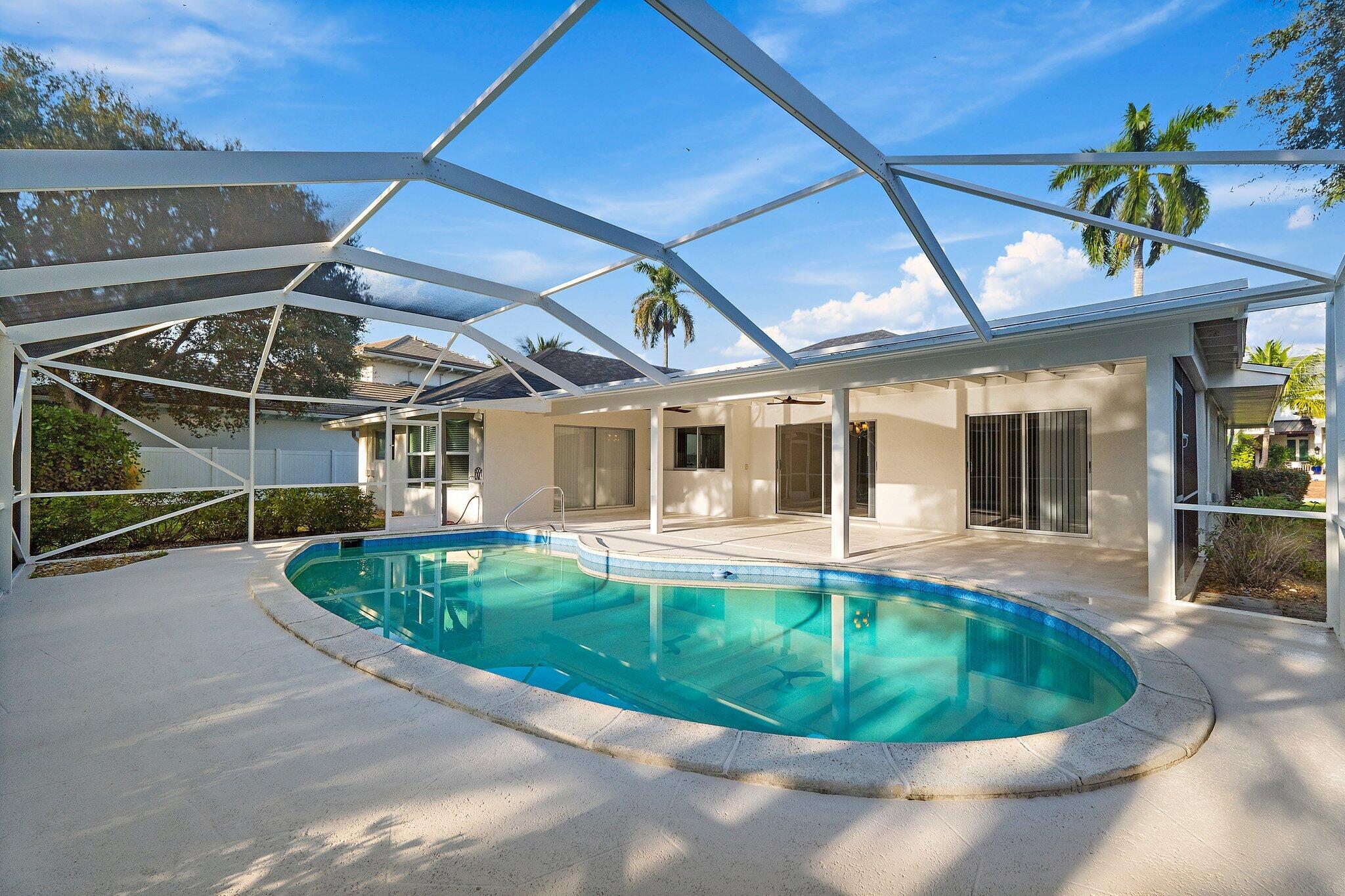 18799 Rio Vista Drive Jupiter, FL 33469 - Photo 4 of 58 a view of a backyard with swimming pool