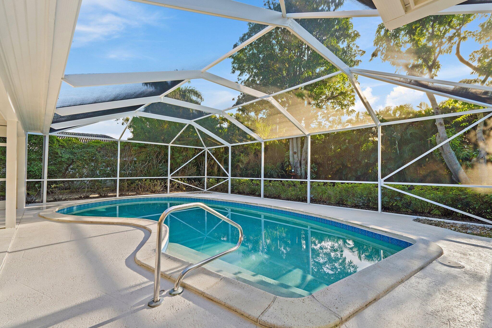18799 Rio Vista Drive Jupiter, FL 33469 - Photo 44 of 58 a view of a backyard with a swimming pool