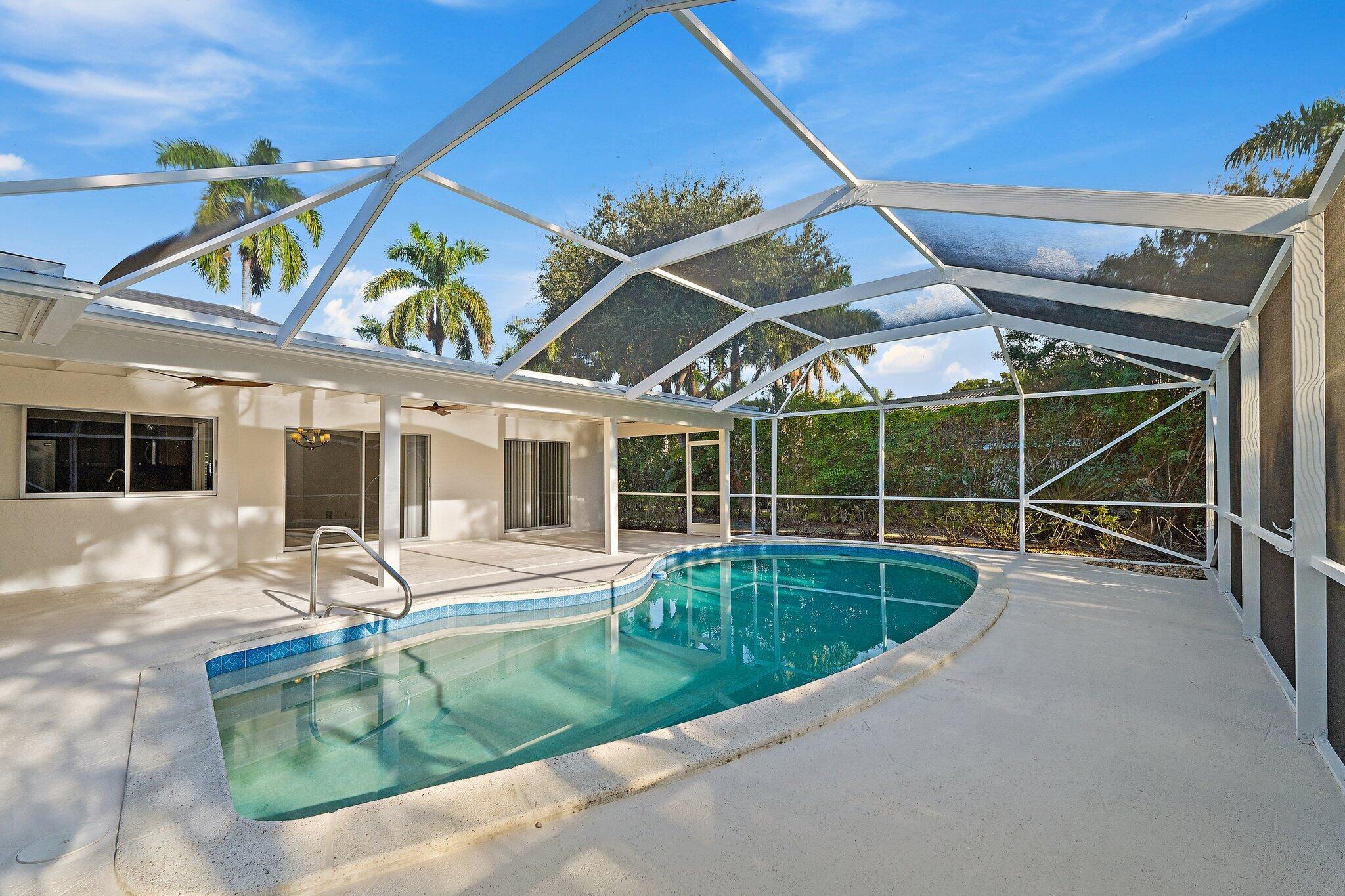 18799 Rio Vista Drive Jupiter, FL 33469 - Photo 45 of 58 a view of a house with pool porch and wooden floor