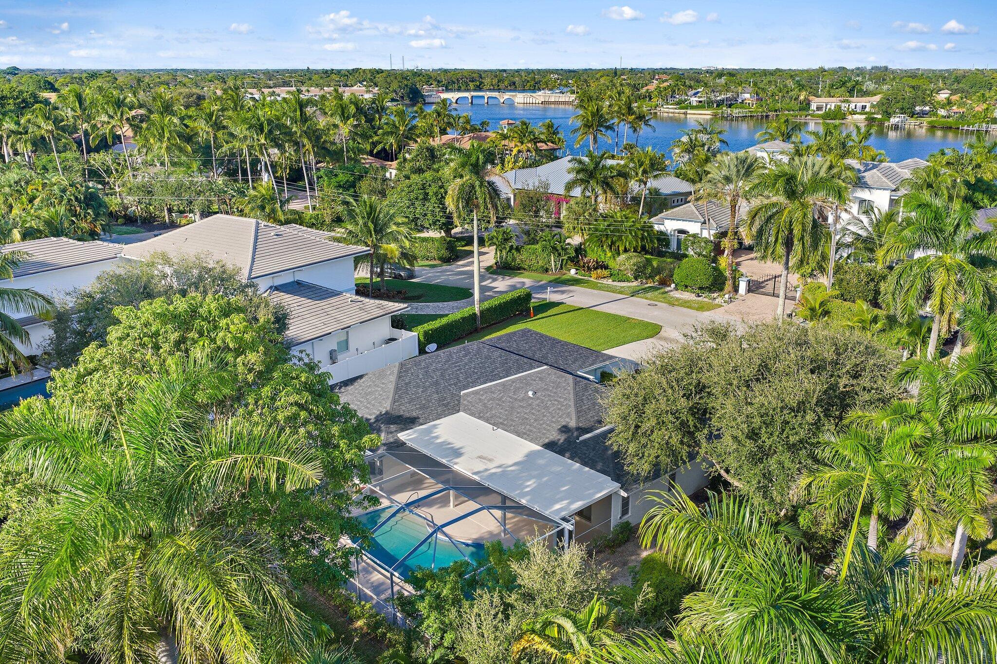 18799 Rio Vista Drive Jupiter, FL 33469 - Photo 49 of 58 an aerial view of a house with a yard