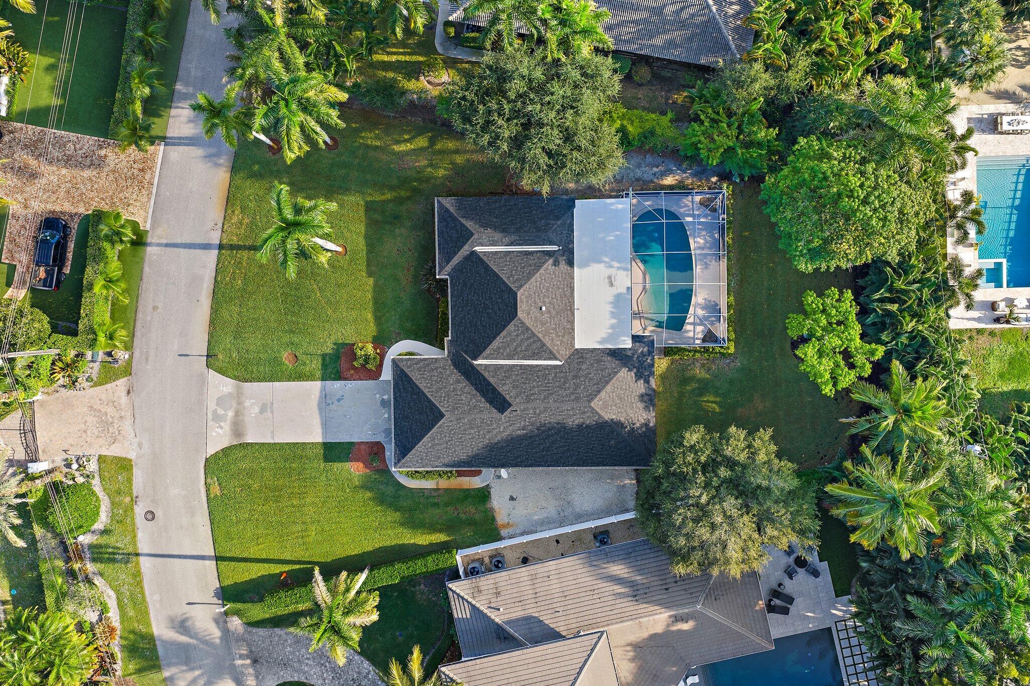 18799 Rio Vista Drive Jupiter, FL 33469 - Photo 53 of 58 an aerial view of a house with swimming pool garden and patio