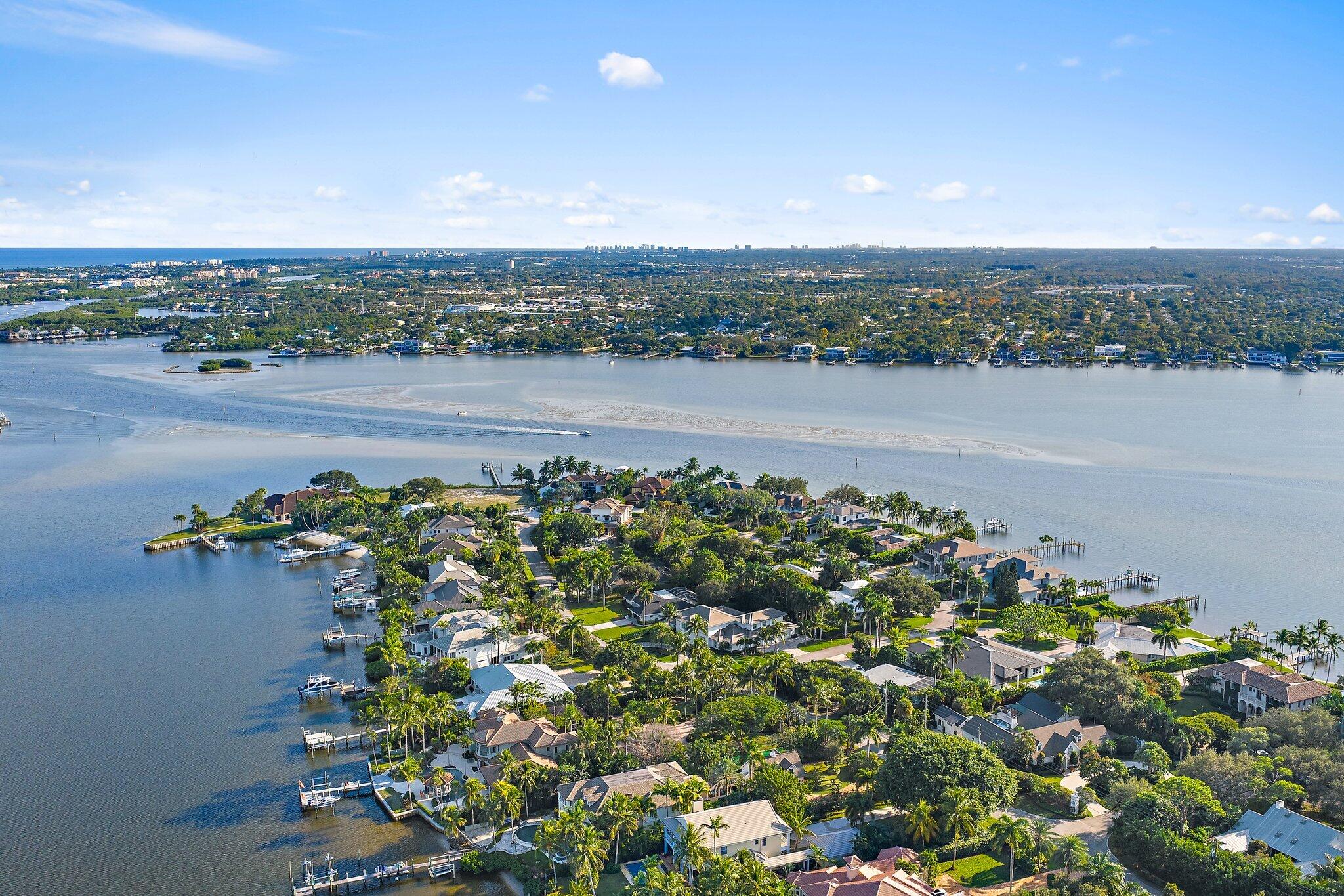 18799 Rio Vista Drive Jupiter, FL 33469 - Photo 57 of 58 an aerial view of a house with a garden and lake view