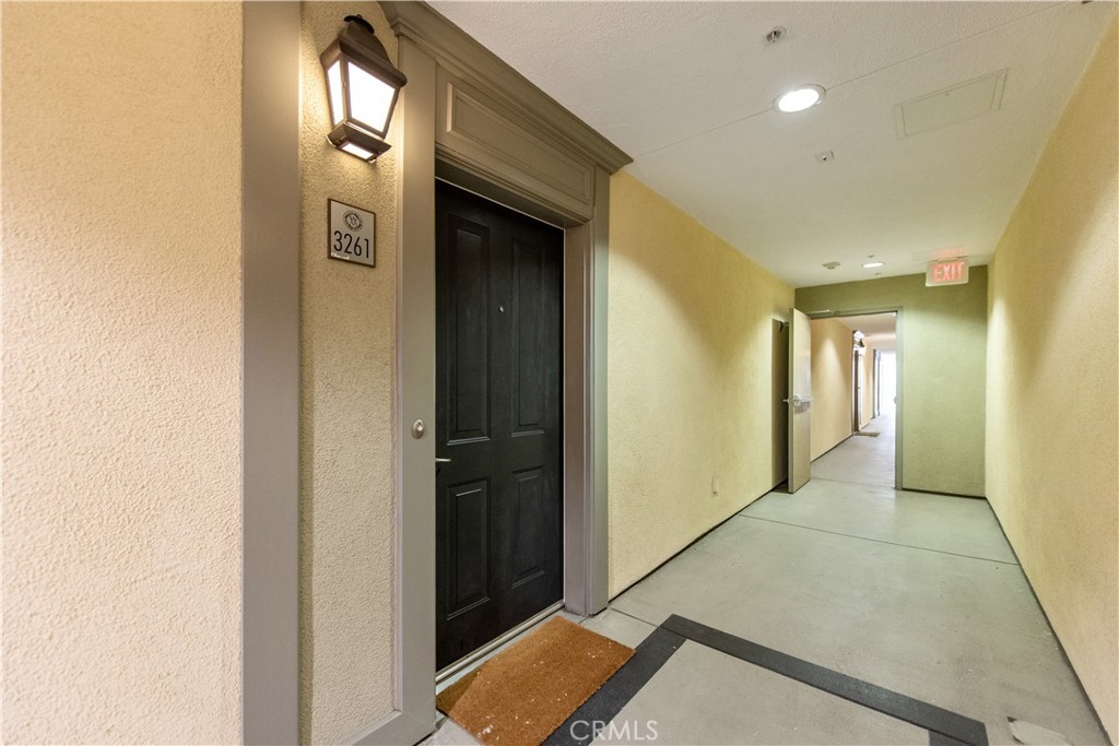 3261 Watermarke Place Irvine, CA 92612 - Photo 14 of 31 a view of hallway with livingroom and wooden floor