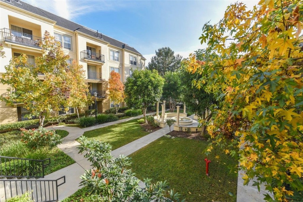 3261 Watermarke Place Irvine, CA 92612 - Photo 18 of 31 a backyard of a house with a garden and outdoor seating