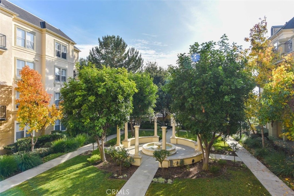 3261 Watermarke Place Irvine, CA 92612 - Photo 20 of 31 a view of a patio with couches table and chairs and potted plants