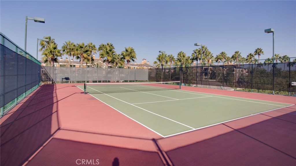3261 Watermarke Place Irvine, CA 92612 - Photo 21 of 31 a tennis court that has a lot of plants in front of it