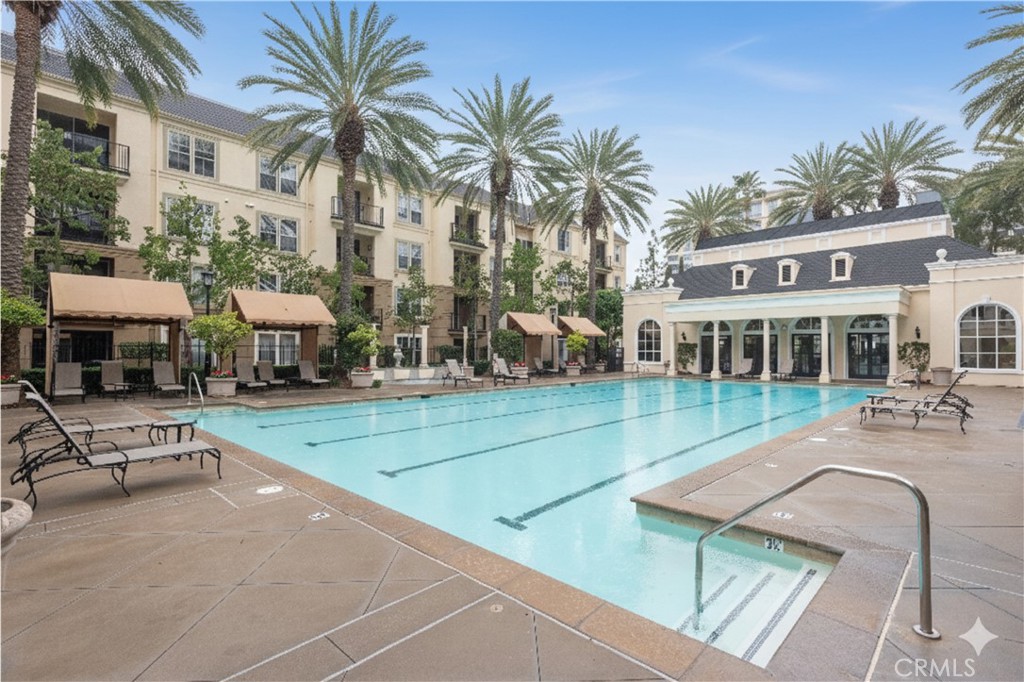3261 Watermarke Place Irvine, CA 92612 - Photo 22 of 31 a view of a house with swimming pool and sitting area
