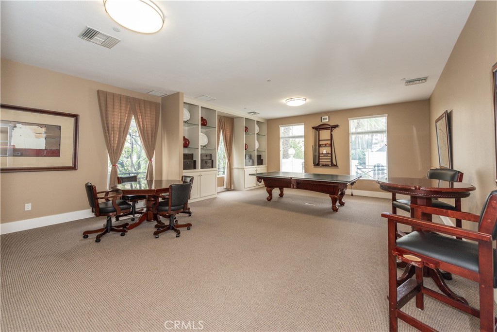 3261 Watermarke Place Irvine, CA 92612 - Photo 27 of 31 a living room with furniture and a window