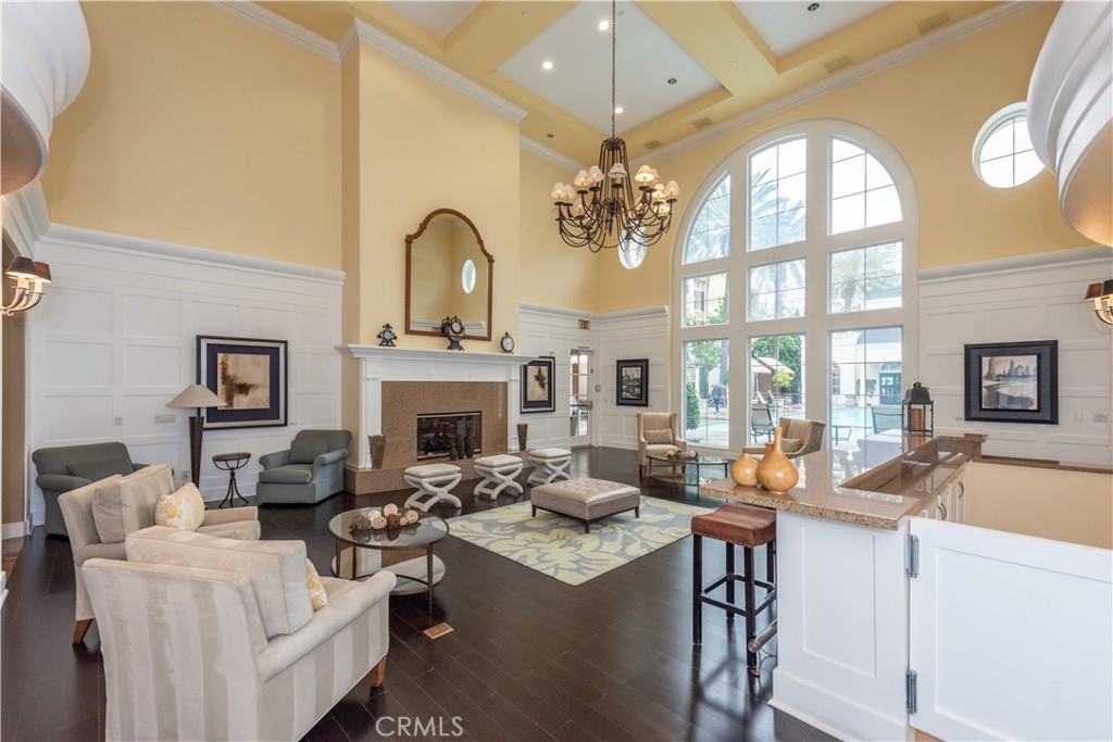 3261 Watermarke Place Irvine, CA 92612 - Photo 29 of 31 a living room with fireplace furniture and a large window