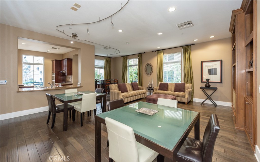 3261 Watermarke Place Irvine, CA 92612 - Photo 30 of 31 a view of a dining room with furniture window and wooden floor