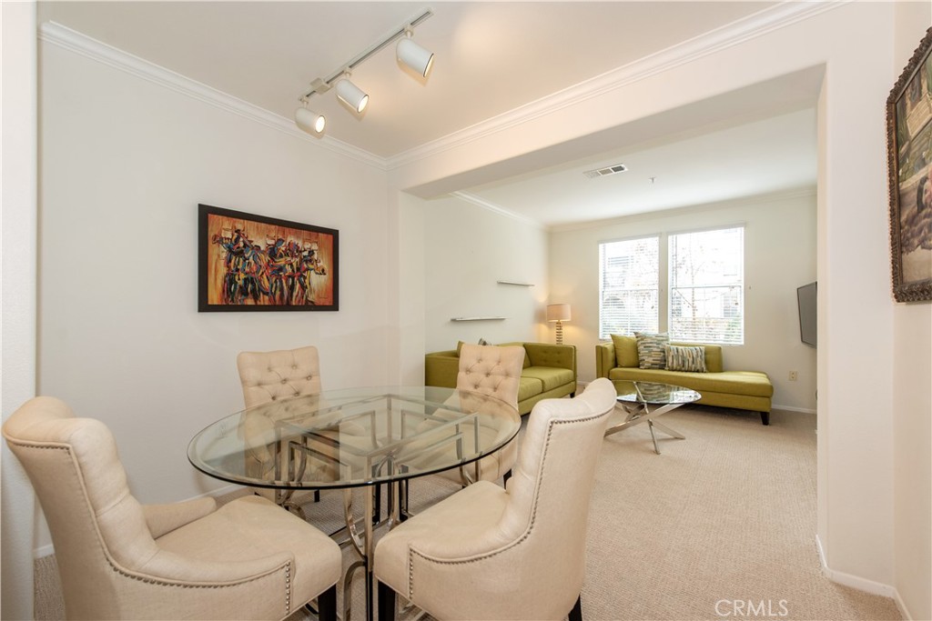 3261 Watermarke Place Irvine, CA 92612 - Photo 3 of 31 a living room with furniture a couch and a window