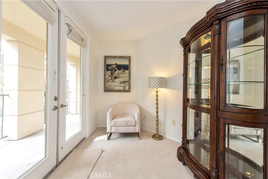 3261 Watermarke Place Irvine, CA 92612 - Photo 8 of 31 a living room with furniture a ceiling fan and a window