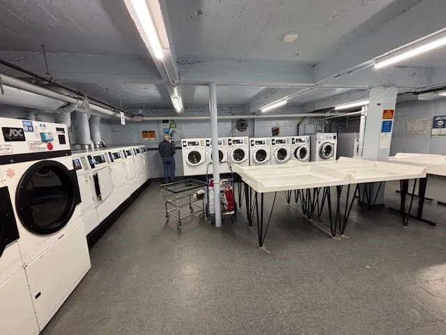 a room with furniture and a large window